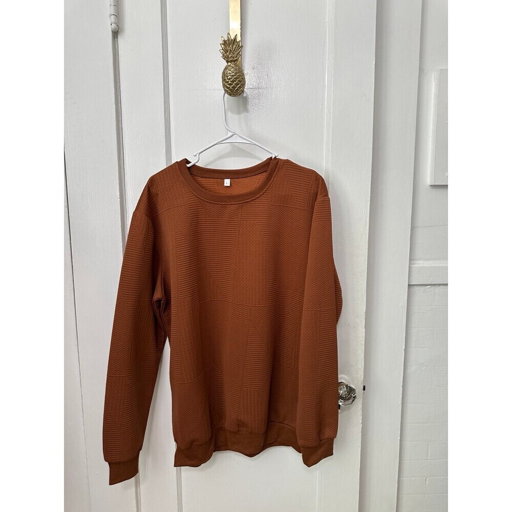 Woman’s size large brown sweater